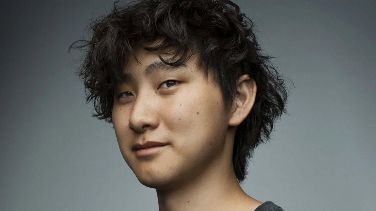 Alexandr Wang, Scale AI founder and Meta Chief AI Officer, in a dark gray T-shirt against a gray background