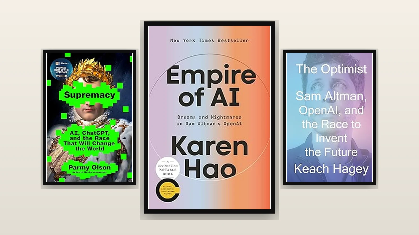 Three framed book covers about OpenAI: Empire of AI centered; Supremacy left; The Optimist right.
