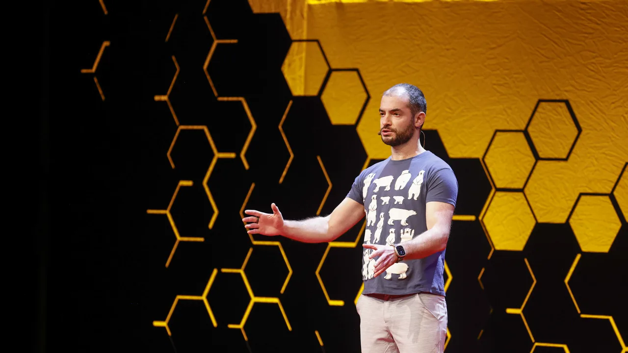 Ilya Sutskever, OpenAI co-founder and SSI CEO, speaking at TED AI San Francisco 2023 against a dark stage backdrop